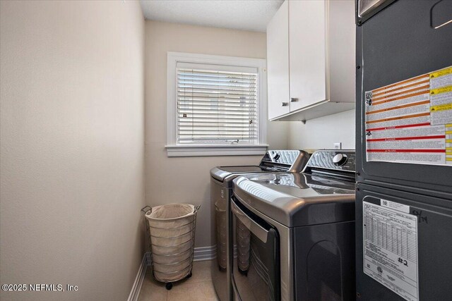 2943 S Ponte Vedra Blvd, Ponte Vedra Beach, FL 32082 - washroom featuring cabinet space, washing machine and dryer, baseboards, and tile patterned floors