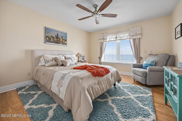 2943 S Ponte Vedra Blvd, Ponte Vedra Beach, FL 32082 - bedroom featuring a textured ceiling, baseboards, wood finished floors, and ceiling fan
