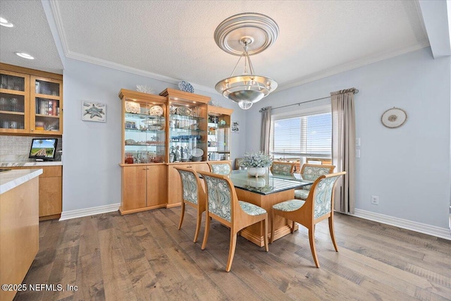 2943 S Ponte Vedra Blvd, Ponte Vedra Beach, FL 32082 - dining room with dark wood-style floors, ornamental molding, a textured ceiling, baseboards, and recessed lighting