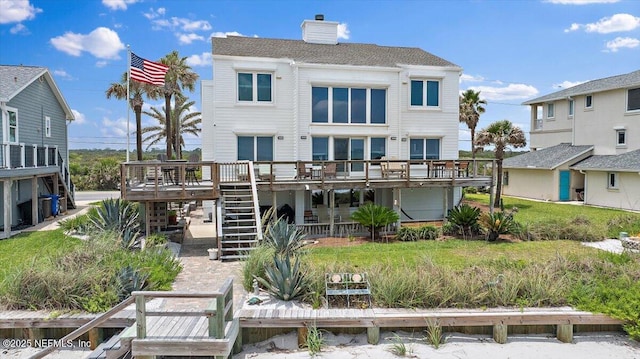 2943 S Ponte Vedra Blvd, Ponte Vedra Beach, FL 32082 - rear view of house with a wooden deck, stairway, and a chimney