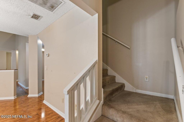 550 Roberts Rd, Saint Johns, FL 32259 - stairs featuring wood finished floors, a textured ceiling, and baseboards