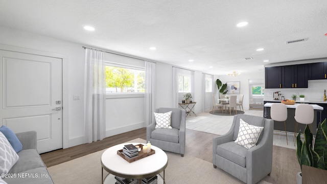 9430 Norfolk Blvd, Jacksonville, FL 32208 - living area with recessed lighting, light wood-style flooring, and baseboards