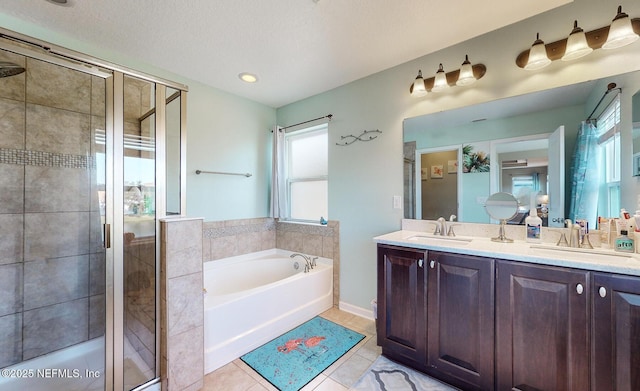 12237 Woodview Dr, Jacksonville, FL 32246 - full bathroom with a bath, a stall shower, double vanity, and tile patterned floors