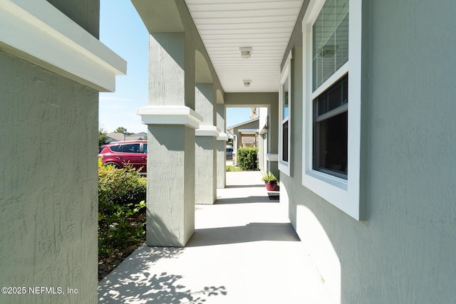 12237 Woodview Dr, Jacksonville, FL 32246 - view of exterior entry with a porch and stucco siding