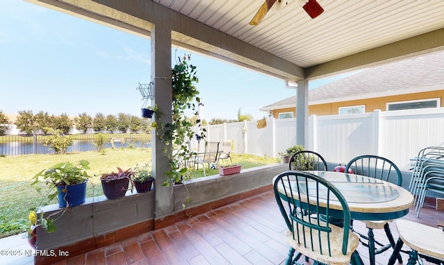 12237 Woodview Dr, Jacksonville, FL 32246 - view of patio with a water view and a ceiling fan