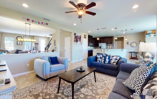 12237 Woodview Dr, Jacksonville, FL 32246 - living room featuring light tile patterned flooring, a ceiling fan, recessed lighting, and baseboards