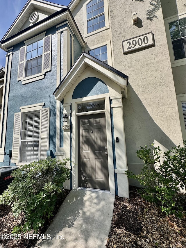 13703 Richmond Park Dr N Unit 2902, Jacksonville, FL 32224 - doorway to property with stucco siding