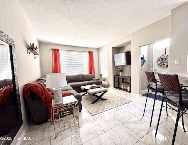 13703 Richmond Park Dr N Unit 2902, Jacksonville, FL 32224 - living room with marble look tile flooring and a textured ceiling