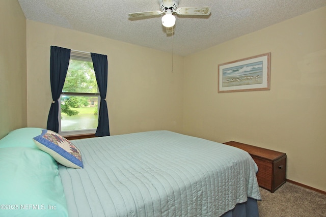 426 Harvest Bend Dr, Fleming Island, FL 32003 - bedroom featuring carpet floors, a textured ceiling, a ceiling fan, and baseboards