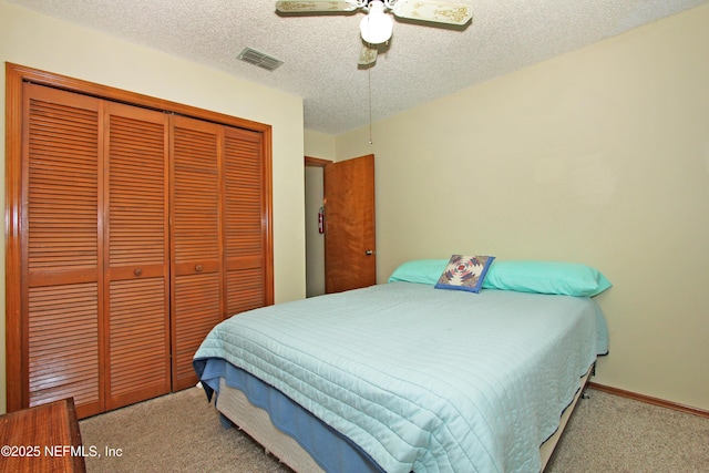 426 Harvest Bend Dr, Fleming Island, FL 32003 - bedroom featuring carpet, a closet, a textured ceiling, a ceiling fan, and baseboards