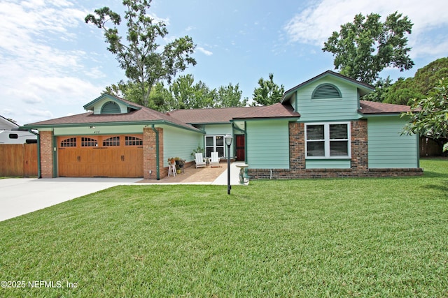 426 Harvest Bend Dr, Fleming Island, FL 32003 - ranch-style house with an attached garage, concrete driveway, brick siding, and roof with shingles