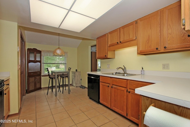 426 Harvest Bend Dr, Fleming Island, FL 32003 - kitchen featuring black dishwasher, a sink, light countertops, light tile patterned floors, and decorative light fixtures