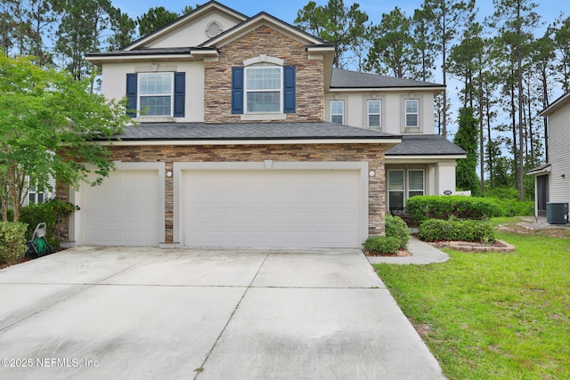 1090 Wetland Ridge Cir, Middleburg, FL 32068 - traditional-style house featuring stucco siding, an attached garage, concrete driveway, stone siding, and a front lawn