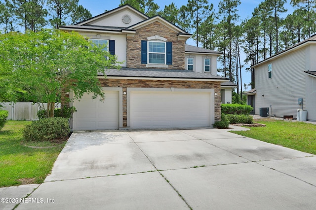 1090 Wetland Ridge Cir, Middleburg, FL 32068 - traditional-style house with stone siding, a garage, concrete driveway, and stucco siding