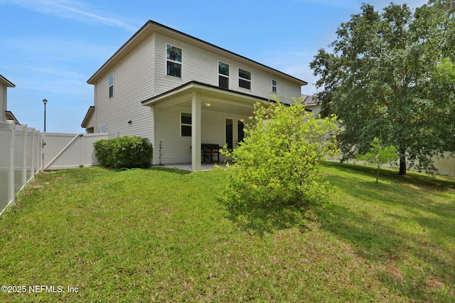 1090 Wetland Ridge Cir, Middleburg, FL 32068 - back of property featuring a patio and a gate