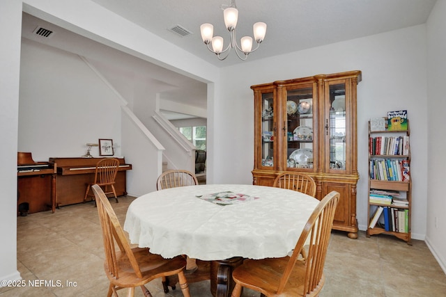 1090 Wetland Ridge Cir, Middleburg, FL 32068 - dining space with a chandelier, stairs, and light tile patterned flooring