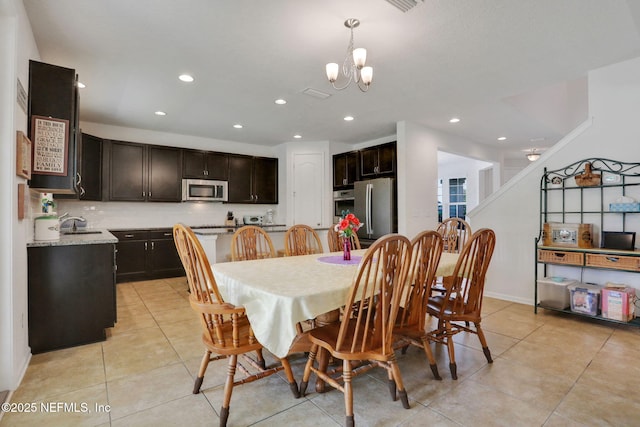 1090 Wetland Ridge Cir, Middleburg, FL 32068 - dining room featuring a chandelier, light tile patterned flooring, and recessed lighting
