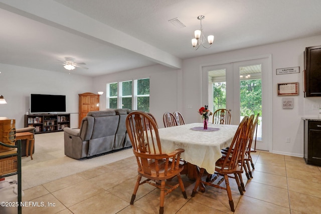 1090 Wetland Ridge Cir, Middleburg, FL 32068 - dining space featuring healthy amount of natural light, light tile patterned flooring, and a chandelier