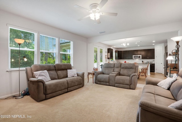 1090 Wetland Ridge Cir, Middleburg, FL 32068 - living room with light colored carpet, ceiling fan, and baseboards