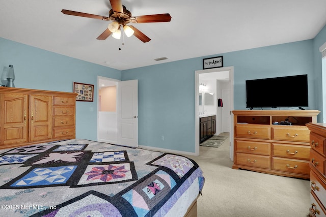 1090 Wetland Ridge Cir, Middleburg, FL 32068 - bedroom featuring light colored carpet, ensuite bath, a ceiling fan, and baseboards