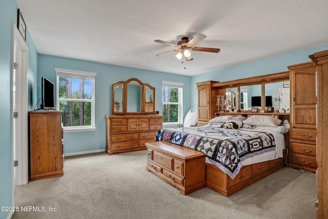 1090 Wetland Ridge Cir, Middleburg, FL 32068 - bedroom with light colored carpet, baseboards, and ceiling fan