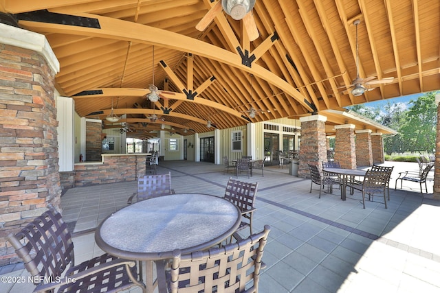 1090 Wetland Ridge Cir, Middleburg, FL 32068 - view of patio / terrace with outdoor dining space, a ceiling fan, and a bar