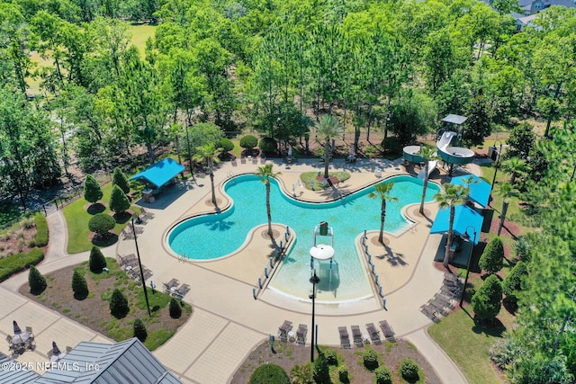 1090 Wetland Ridge Cir, Middleburg, FL 32068 - community pool featuring a patio and view of wooded area