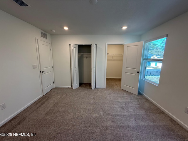 13525 Ute Pl, Jacksonville, FL 32218 - unfurnished bedroom with two closets, carpet, recessed lighting, and baseboards