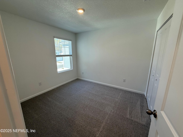 13525 Ute Pl, Jacksonville, FL 32218 - unfurnished bedroom with carpet, a textured ceiling, baseboards, and a closet