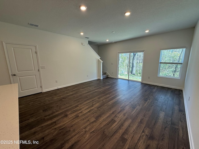 13525 Ute Pl, Jacksonville, FL 32218 - unfurnished room featuring stairway, dark wood-style floors, baseboards, and recessed lighting