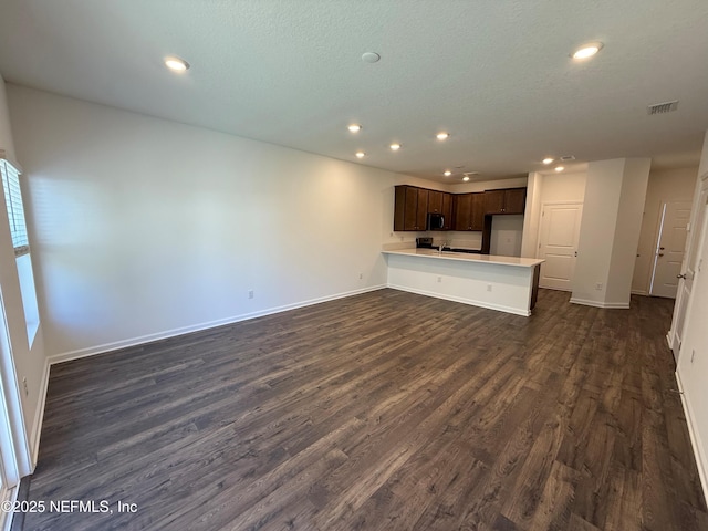 13525 Ute Pl, Jacksonville, FL 32218 - unfurnished living room featuring recessed lighting, dark wood-type flooring, and baseboards