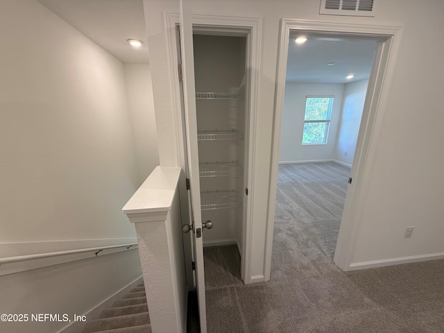 13525 Ute Pl, Jacksonville, FL 32218 - corridor featuring dark carpet and baseboards