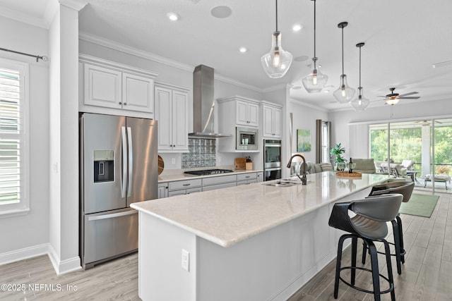 220 Hoptree Pl, Saint Johns, FL 32259 - kitchen with appliances with stainless steel finishes, wall chimney exhaust hood, light wood-style flooring, recessed lighting, and a sink