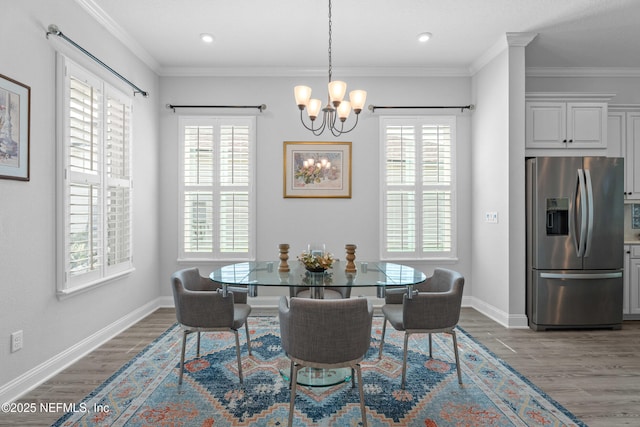 220 Hoptree Pl, Saint Johns, FL 32259 - dining room featuring wood finished floors, a chandelier, plenty of natural light, ornamental molding, and recessed lighting