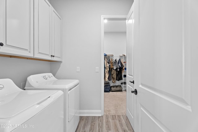 220 Hoptree Pl, Saint Johns, FL 32259 - washroom with washing machine and dryer, cabinet space, light wood-style flooring, and baseboards