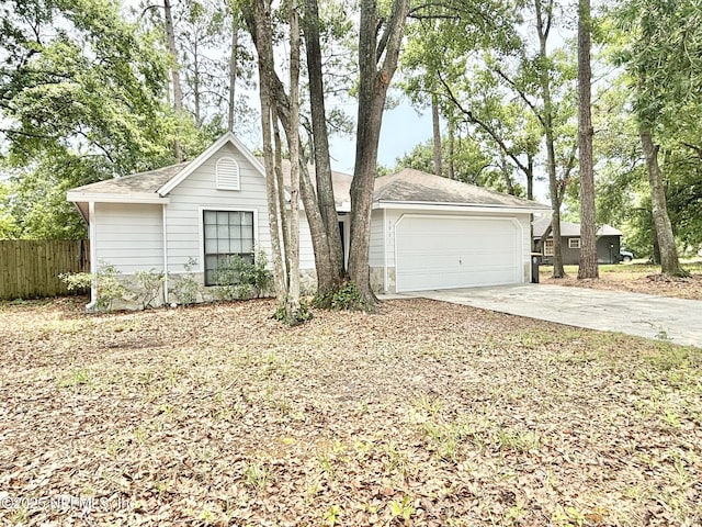 3951 Hunters Lake Cir W, Jacksonville, FL 32210 - single story home with driveway, an attached garage, and a shingled roof