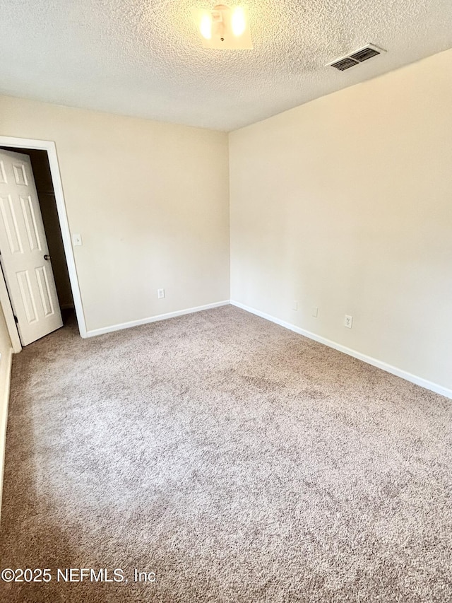 3951 Hunters Lake Cir W, Jacksonville, FL 32210 - empty room with carpet flooring, a textured ceiling, and baseboards