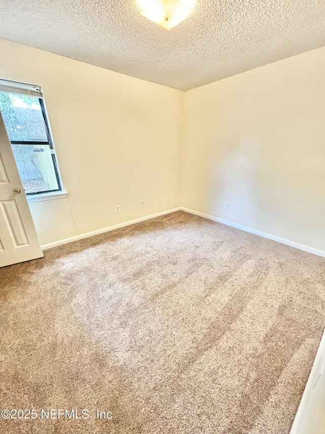 3951 Hunters Lake Cir W, Jacksonville, FL 32210 - carpeted empty room featuring a textured ceiling and baseboards
