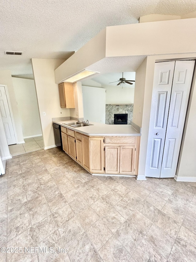 3951 Hunters Lake Cir W, Jacksonville, FL 32210 - kitchen with light brown cabinets, a ceiling fan, a high end fireplace, a textured ceiling, and light countertops
