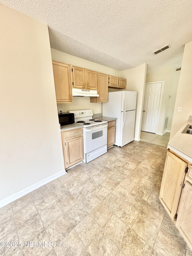 3951 Hunters Lake Cir W, Jacksonville, FL 32210 - kitchen featuring white appliances, light brown cabinetry, under cabinet range hood, light countertops, and a textured ceiling