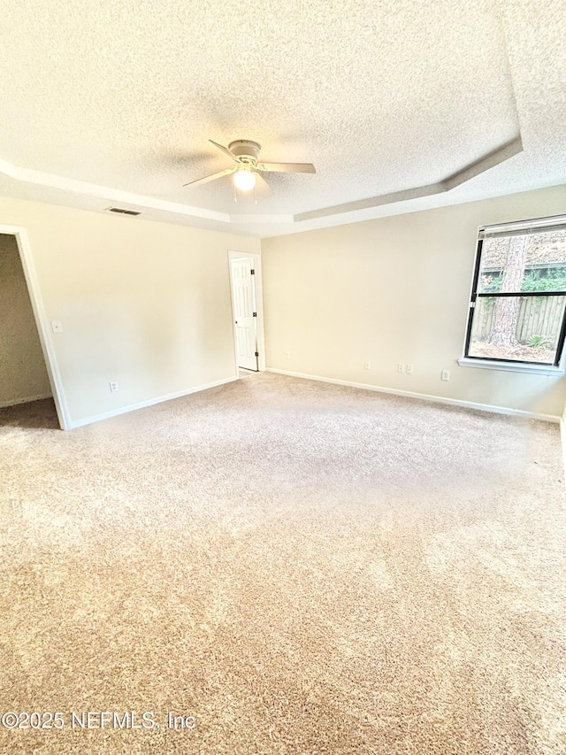 3951 Hunters Lake Cir W, Jacksonville, FL 32210 - spare room with a textured ceiling, ceiling fan, carpet flooring, and baseboards