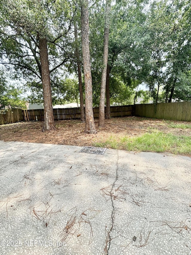 3951 Hunters Lake Cir W, Jacksonville, FL 32210 - fenced backyard featuring a patio area