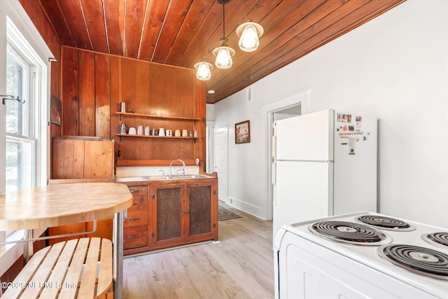 27 Grant St, Saint Augustine, FL 32084 - kitchen with range, wood ceiling, a sink, freestanding refrigerator, and decorative light fixtures