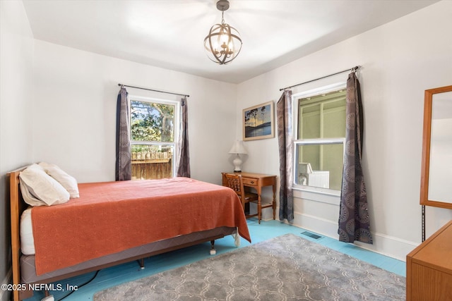 27 Grant St, Saint Augustine, FL 32084 - bedroom featuring a chandelier