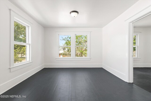 27 Grant St, Saint Augustine, FL 32084 - unfurnished room featuring dark wood-type flooring and baseboards