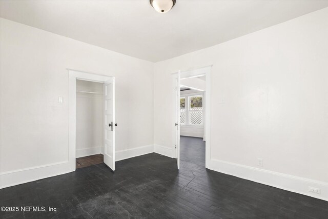 27 Grant St, Saint Augustine, FL 32084 - spare room featuring baseboards and wood finished floors