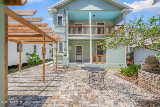 27 Grant St, Saint Augustine, FL 32084 - back of property with a balcony, a porch, and a pergola