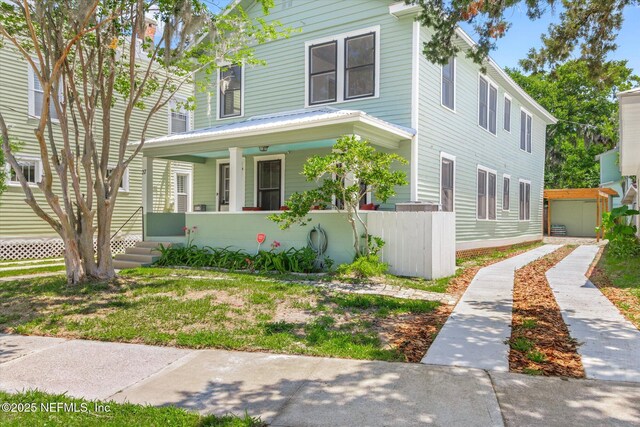 27 Grant St, Saint Augustine, FL 32084 - traditional style home featuring a porch