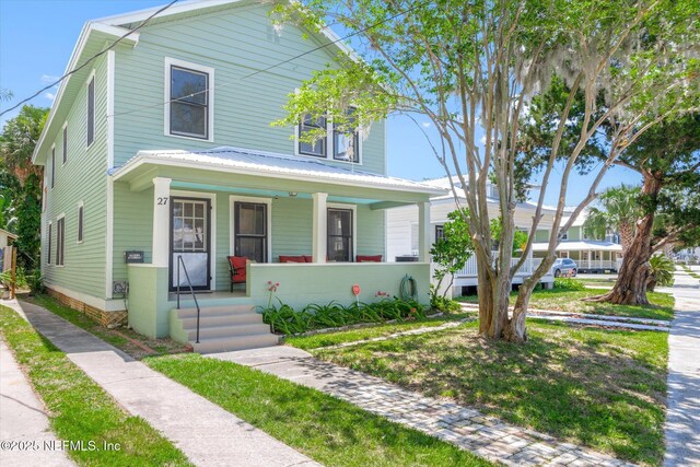 27 Grant St, Saint Augustine, FL 32084 - traditional style home featuring covered porch and metal roof