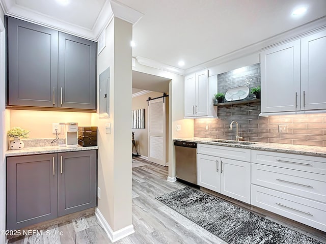 5375 Ortega Farms Blvd Unit 1011, Jacksonville, FL 32210 - kitchen with dishwasher, a sink, crown molding, baseboards, and decorative backsplash
